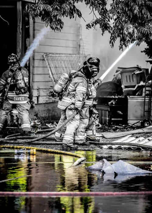 Careers 1 A dramatic photo of firefighters spraying water on a fire