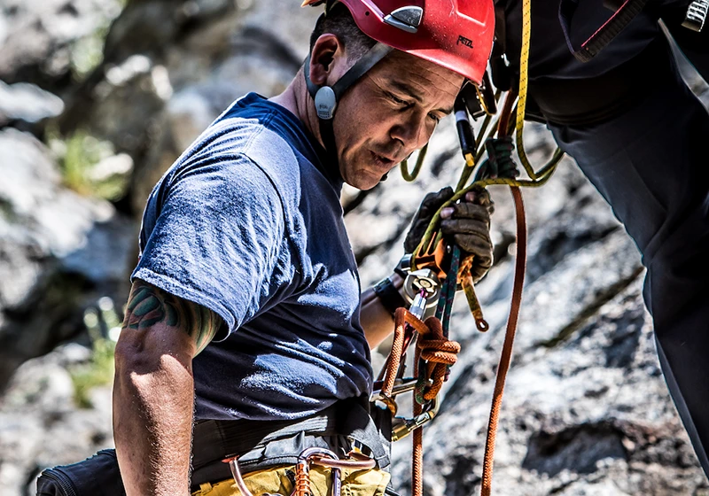 a firefighter performing a rope rescue